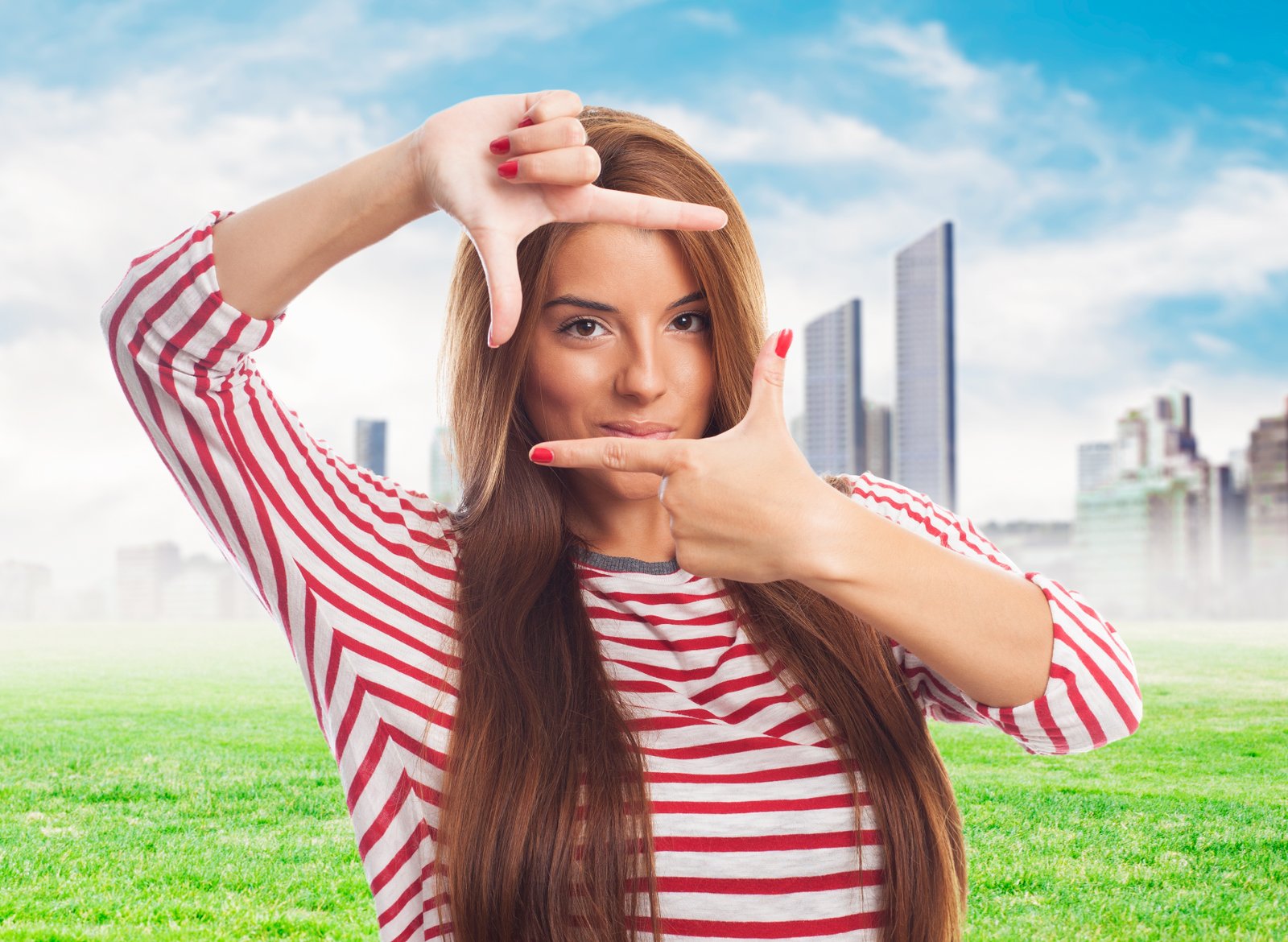 portrait of a young woman doing a frame gesture
